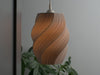 Large gray ceiling light shade with an eye-catching spiral structure. Stylish and modern lighting solution.