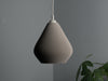 Elegant gray pendant light shade with a teardrop shape, perfect for bedrooms and dining areas.