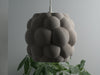 Gray table lamp shade with a unique bubble-textured design for warm, diffused lighting.