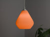 Vibrant orange Lun lampshade with a teardrop shape and pleated design. A bold ceiling lamp shade for stylish interiors.