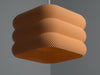 Unique orange pendant light shade, featuring a stylish pleated design for contemporary interiors.