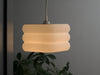 Stylish white ceiling light shade with a pixel-inspired design, creating a warm and inviting ambiance.