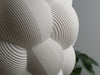 Soft white table lamp shade with a bubble-inspired design, offering warm and cozy lighting.